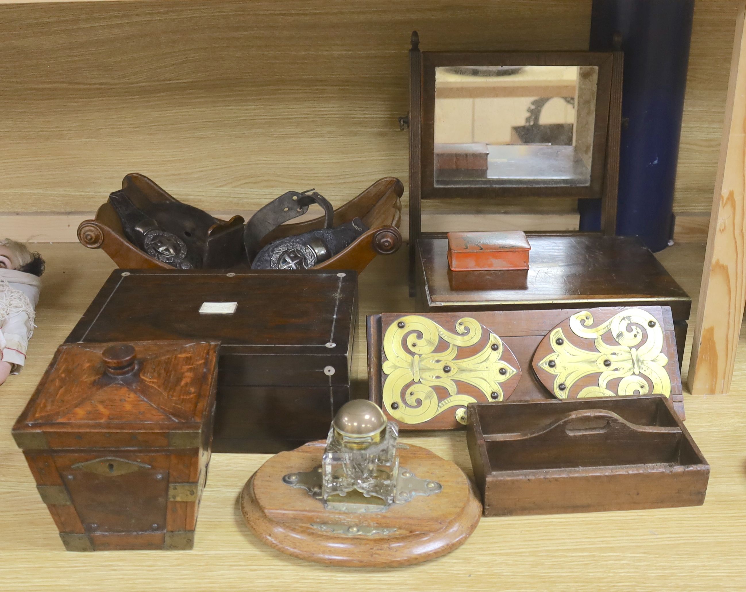 A Victorian mahogany cheese coaster, 40cm, an early 19th century toilet mirror, 29cm, an oak tea caddy, a book slide, an ink stand and sundry boxes